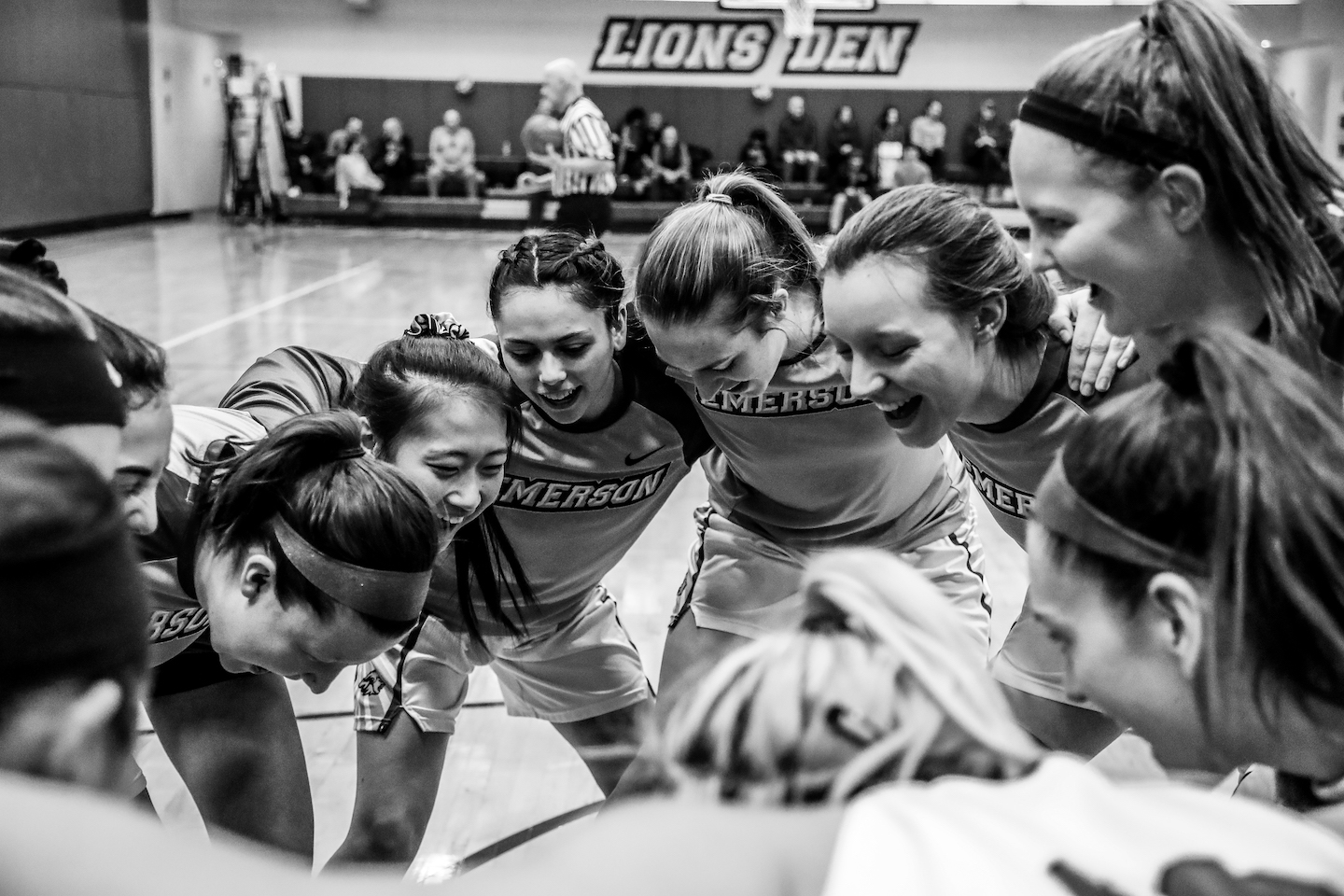 Image of students huddling during a sports game