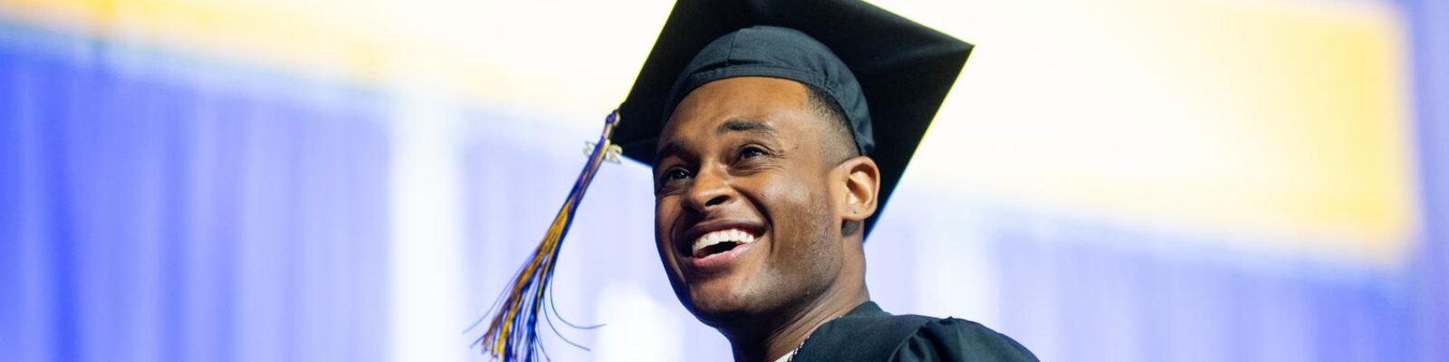 Portrait of students at graduation wearing cap and gown